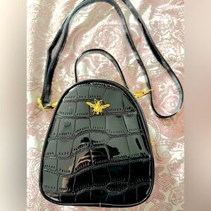 Black Shiny Handbag with Gold Bee Detail.